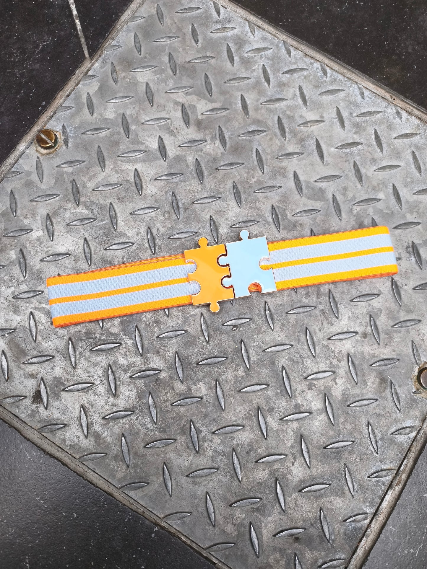 Essentiel riem puzzel blauw/oranje